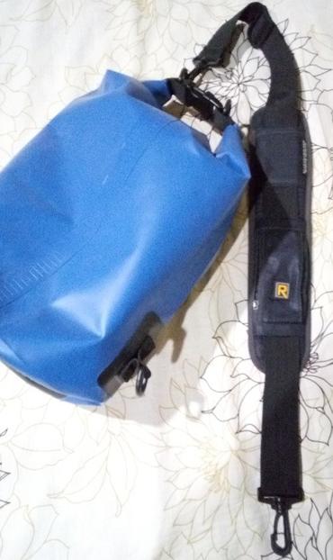 Photo of a dry bag with an old Blackrapid strap's shoulder pad added.