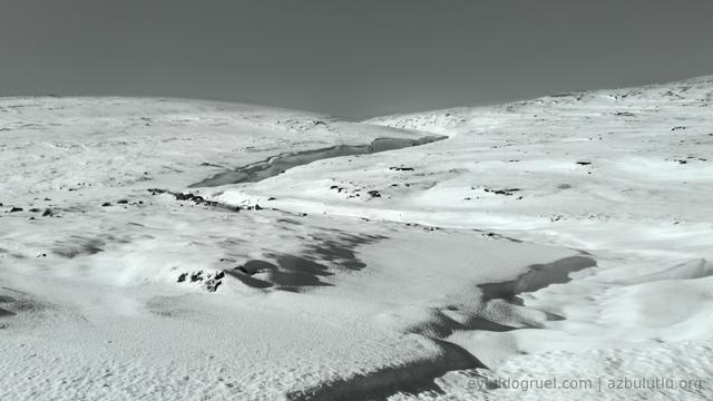photograph of the abstract shape of a edge within the snow. CC by-SA Eylul Dogruel