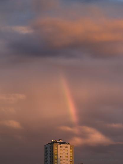 a sunset rainbow before an apartment building CC by-SA 2019 Eylul Dogruel