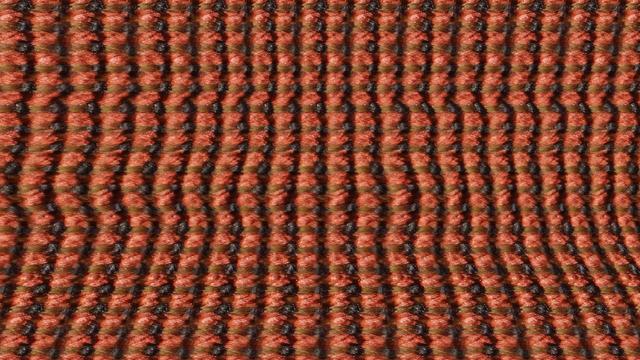 close up texture of red/orange/black regular woven fabric, distorted.  when viewing the image with eyes crossed, a hidden image appears via binocular/stereo depth perception