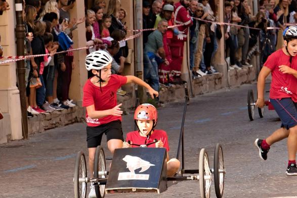 race on cars pushed by runners
