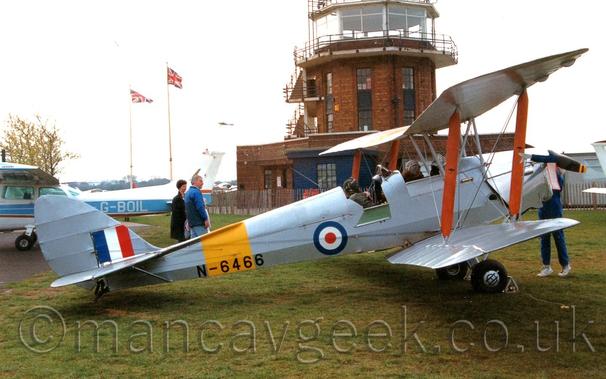 Privately owned DH82 in RAF markings at Barton Airport, 1990s.