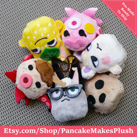 A group photo of all my Animal Crossing amiibo plushies laying in a circle with their heads pointed toward the center. Starting at the bottom center and moving clockwise is Raymond, Zucker, Tangy, Marina, Marshall and Coco.