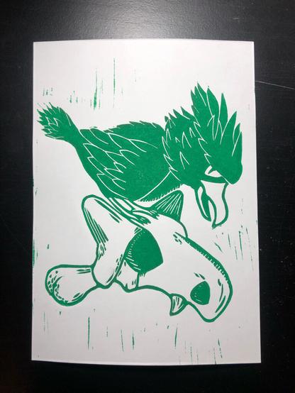 a relief print of the Pokémon Murkrow standing on top of a Cubone skull