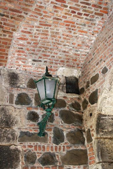 An old lamp in an archway