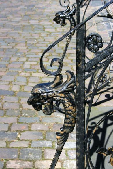 Dragon heads as handles on a stair railing