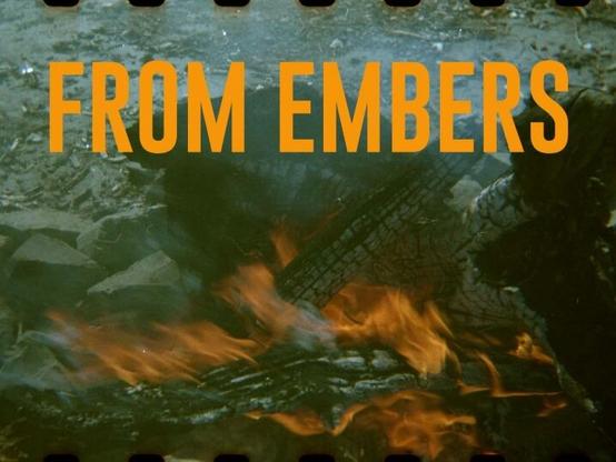Burning wood in a fire pit appearing as a still from film