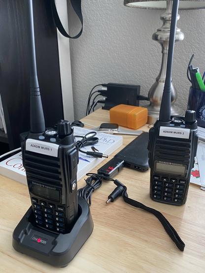 Two BTECH MURS V1 radios for license-free radio communications at 2 watts. Charging with a standard 5 volt USB external battery pack, upconverted to 9V with a converter cable, and seemingly good enough for the 10V charger. Field operation with recharging is just as convenient as my ham handheld transceivers.