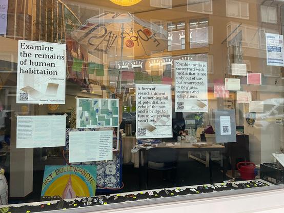 Photo of one of the window displays. Some quotes have been printed and there is also documentation from ongoing research of the second year students of XPUB.