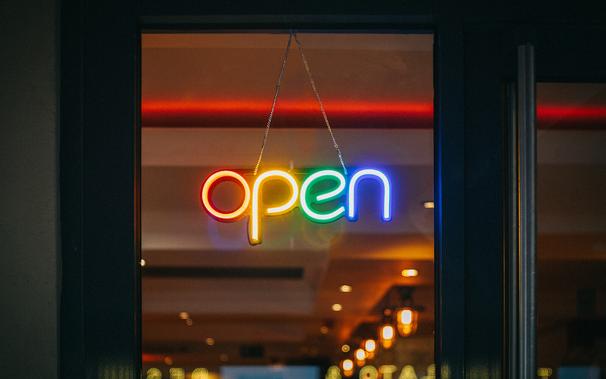 colorful open neon sign in window
