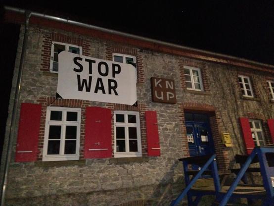Social club with Stop War banner