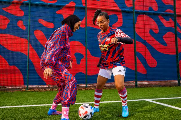 Two women playing football in Stella McCartney for Adidas kits