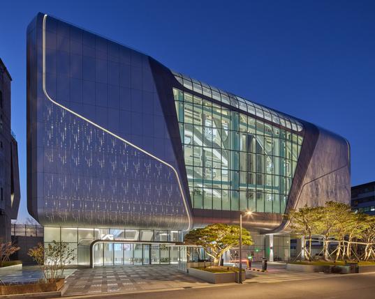 Metal and glass wraps around the exterior of YG HQ