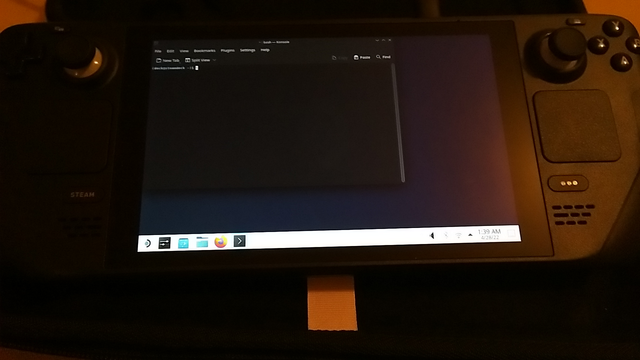 A steam deck with desktop view active, running Arch Linux and KDE Plasma.