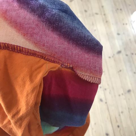 The inside of a very colourful pillow cover.