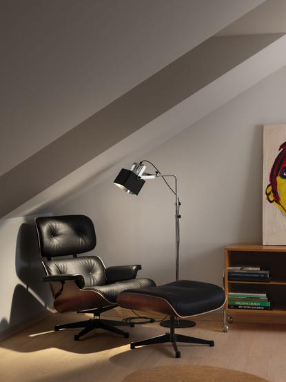 Luminaires Series 100 floor lamp next to a mid century chair