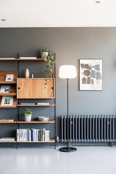 Soft floor lamp by Case Furniture next to a bookcase