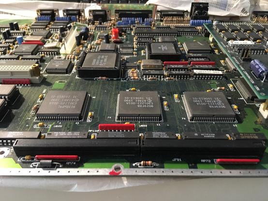 photo of a section of an Atari TT mainboard with the mentioned connectors at the bottom. There should be a pair of ribbon cables, which are missing.