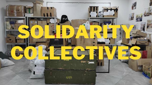 Storage space with boxes of supplies, "Solidarity Collectives"