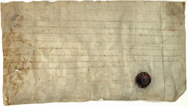 Pergamenturkunde, an den Rändern beschädigt, unten Signumszeile mit Monogramm Karls des Großen und restauriertem Wachssiegel