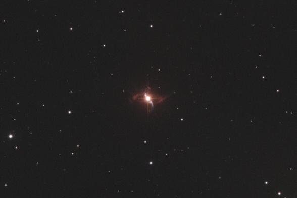 Picture showing a nebula formed by two stars. The only star visible is the bright red giant. The nebula has the shape of a lawn sprinkler shooting out water, or perhaps a ballerina spinning with her arms and legs slightly bent vertically.
This picture was made from RGB only data.
Data courtesy of iTelescope.net
