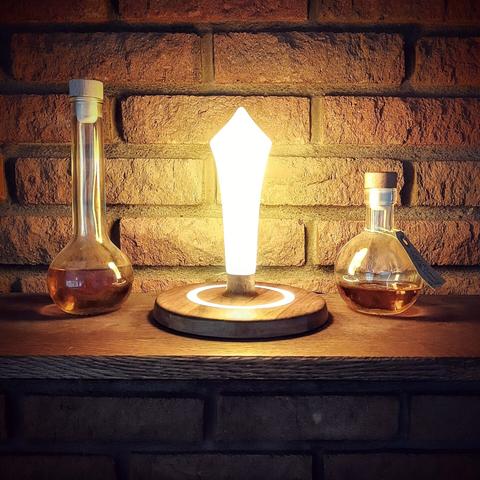 Walnut wood and epoxy lamp, a minimal take on the site of grace of Elden Ring.