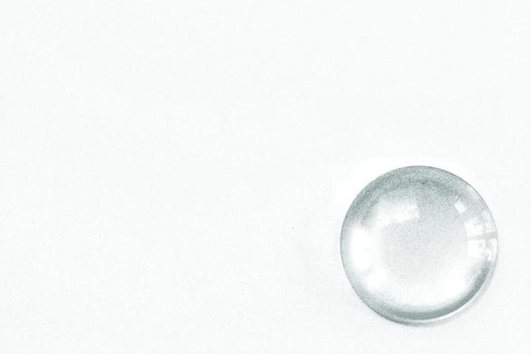 It looks a like a bubble on a plain white background but it's the lens from some ancient bit of darkroom kit that hasn't been used for over 17 years. Darkroom loses to nursery.