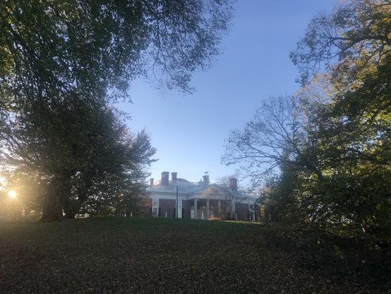 Monticello in the evening, surrounded by foliage