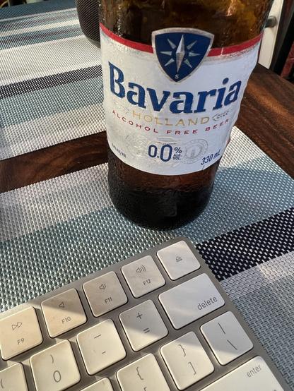 Keyboard and beer bottle