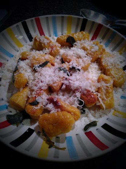 Plate of gnocchi made with pumpkin, sage, nutmeg, cinnamon and Parmesan