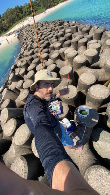 Me on a rock wall at Yarra bay in Sydney, surrounded by blackfishing gear and ready to rock