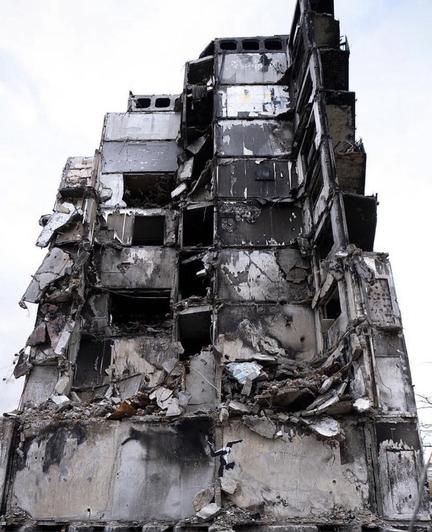 Crumbled building in Kyiv with Banksy gymnast artwork