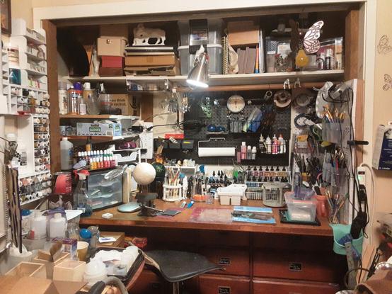 A photo of a very full, but organized, closet craft station.