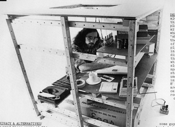 Person sitting at a modular desk made of different pieces of wood that can attach in different ways to create something new.