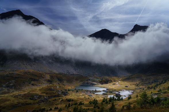 Lakes on a misty morning in the Taillefer mounts, french Alps