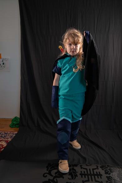a child posing dramatically