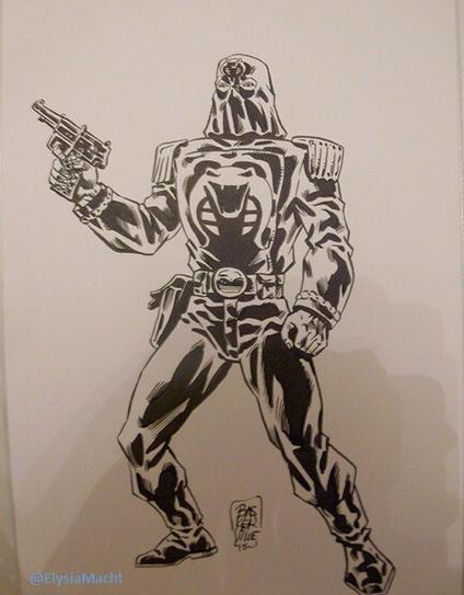 A black & white Cobra Commander piece with him holding a gun, whatever.

Wearing a hood, of course. 

Stephen Baskerville did this one specifically for me, unlike the Blurr I think was ready & waiting for whoever.

Not my favourite Commander, but eh, it's art & all good.