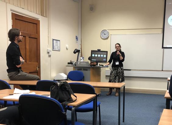 Me (Andrea Vaughan) standing at the front of a seminar room answering questions