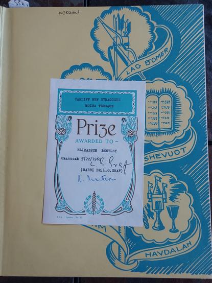 Inside cover of the book with a bookplate. Text: Cardiff New Synagogue, Moira Terrace. Prize awarded to Elizabeth Bentley. Chanukah 5722/1961 (Rabbi Dr. L.G. Graf). E.S.A., London, No. 12.