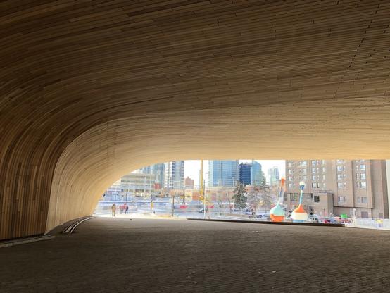 From entrance of the Calgary Central Library looking towards the city. The entrance arch is designed to mimic the Chinook arch.