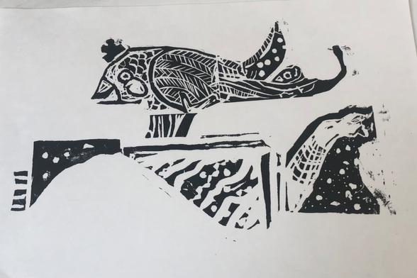 Black and white relief print of a bird with a crown standing on a decorative fragmented wall.