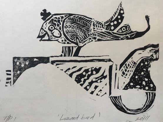 Black and white relief print of a bird with a crown standing on a decorative fragmented wall.
