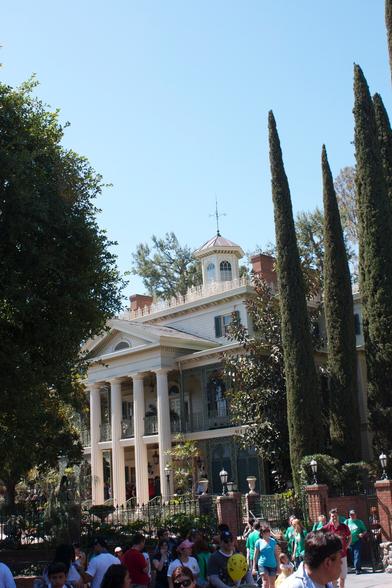 View of the decorative Haunted Mansion building, that only serves as the ride entrance and exit, and as the elevator housing, but doesn't contain the ride itself.
