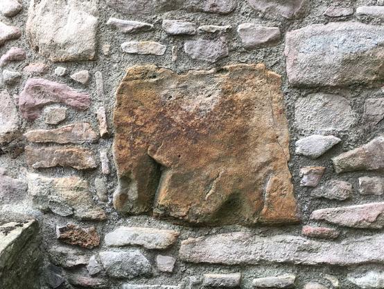 Mastodon looking like stone in the wall of Craigmillar Castle in Edinburgh