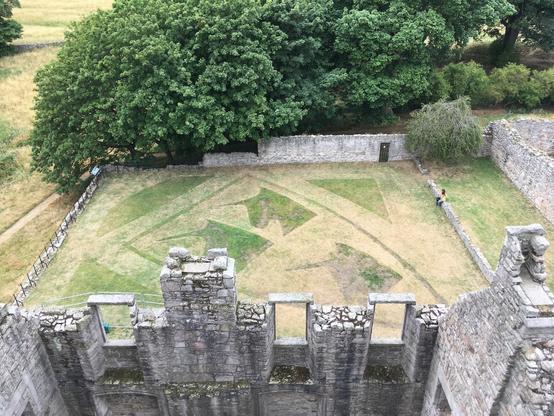 View from the walls of Craigmillar Castle in Edinburgh - lawn trimmed in to the likeness of unicorns heads
