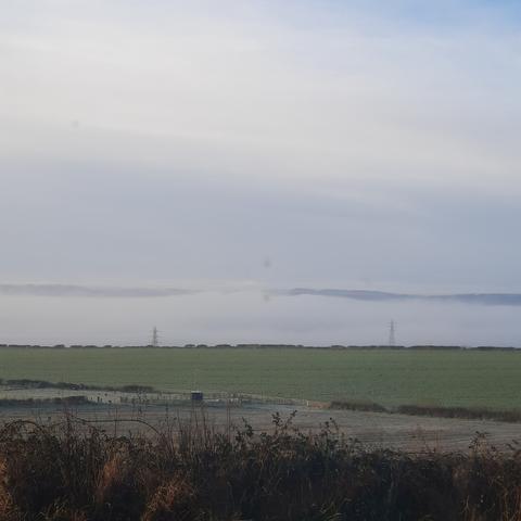 Frosty temperature inversion, fog down in the valley, Stanhope Moor way beyond.