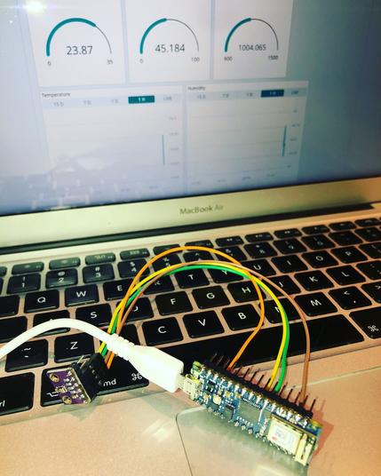 An Arduino Nano 33IoT connected to a BME280 sensor board. The screen displays the dashboard with temperature, humidity and pressure.