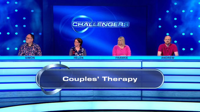 Four people - with name plates identifying them as Simon, Helen, Frankie and Andrew - sit behind a long desk in a TV studio. A caption at the front has their team name, "Couples' Therapy"