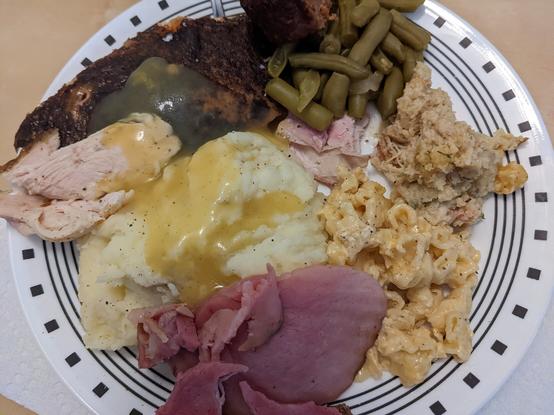 Thanksgiving dinner. Deep fried turkey, roasted turkey, ham, impossible meatloaf, mashed potatoes, green beans, stuffing, and mac/cheese.