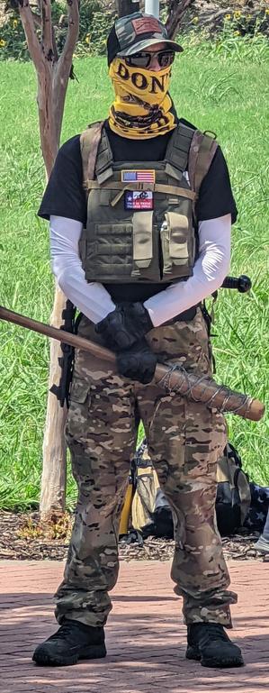 Punk Ass Felon holding baseball bat wrapped in barbed wire